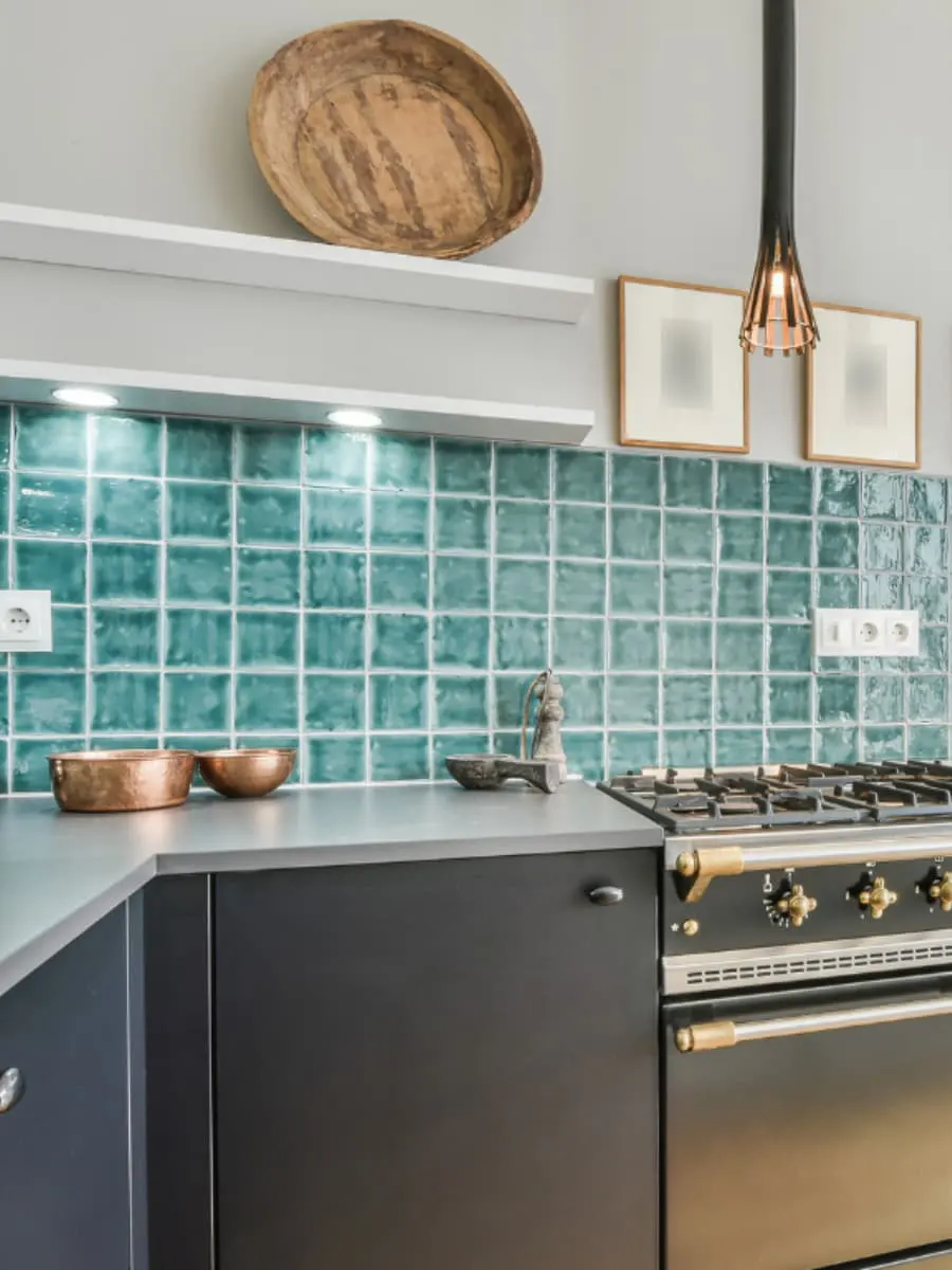 Gray Kitchen Countertop with blue tiles on wall | Francini Inc Popular Stones in Denver