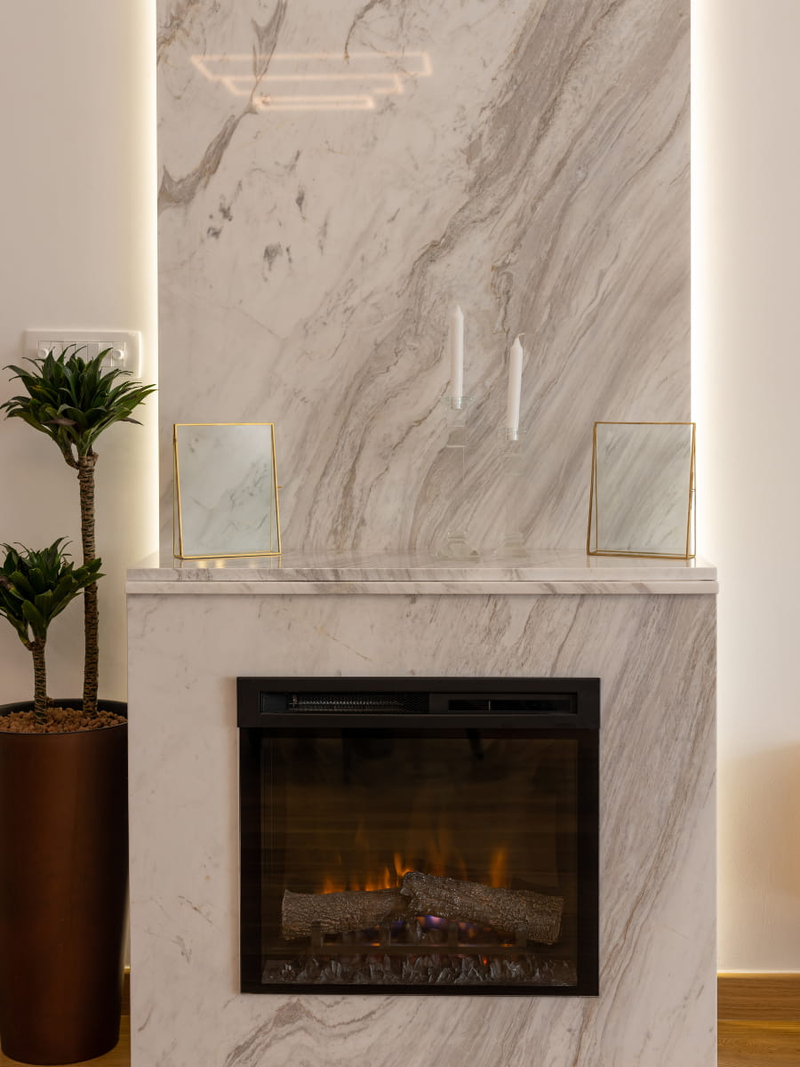 a fireplace made out of marble from Francini Inc.